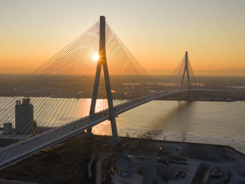 Gordie Howe International Bridge spanning the Detroit River between Windsor, Ontario and Detroit, Michigan at sunset